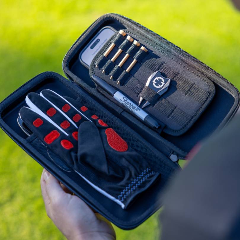 EXO Glove Case - open showing how it stores EXO golf glove, sharpie, divot tool and tees, cellphone and more