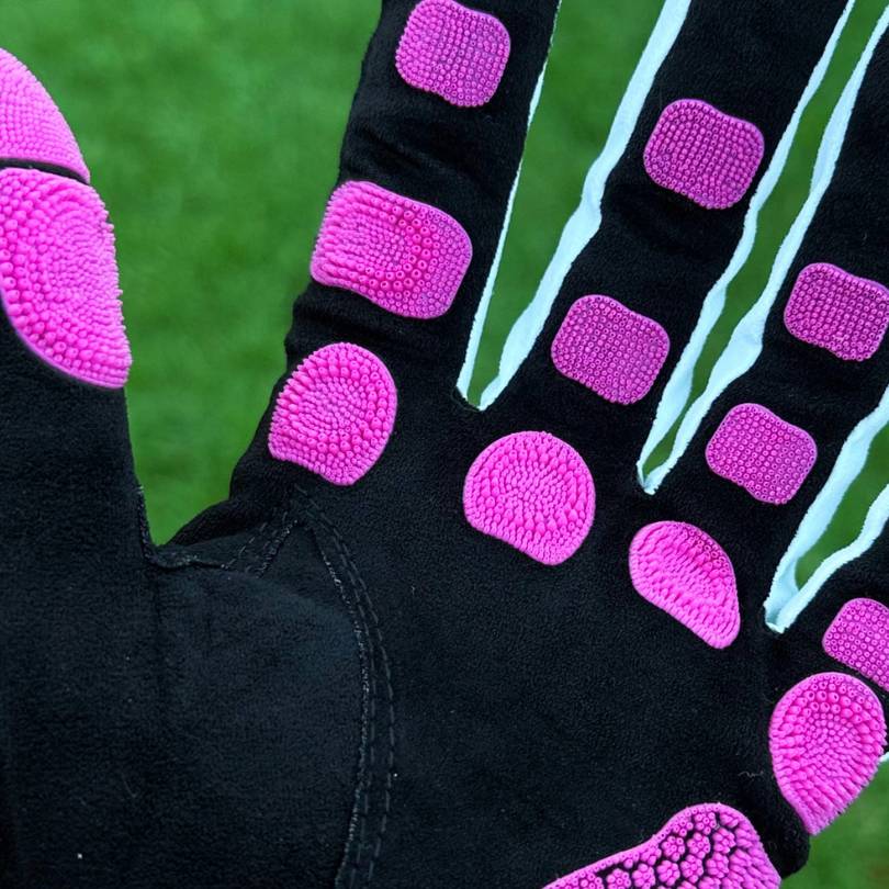EXO golf glove  - Palm open showing pink colorway nanocells on black palm