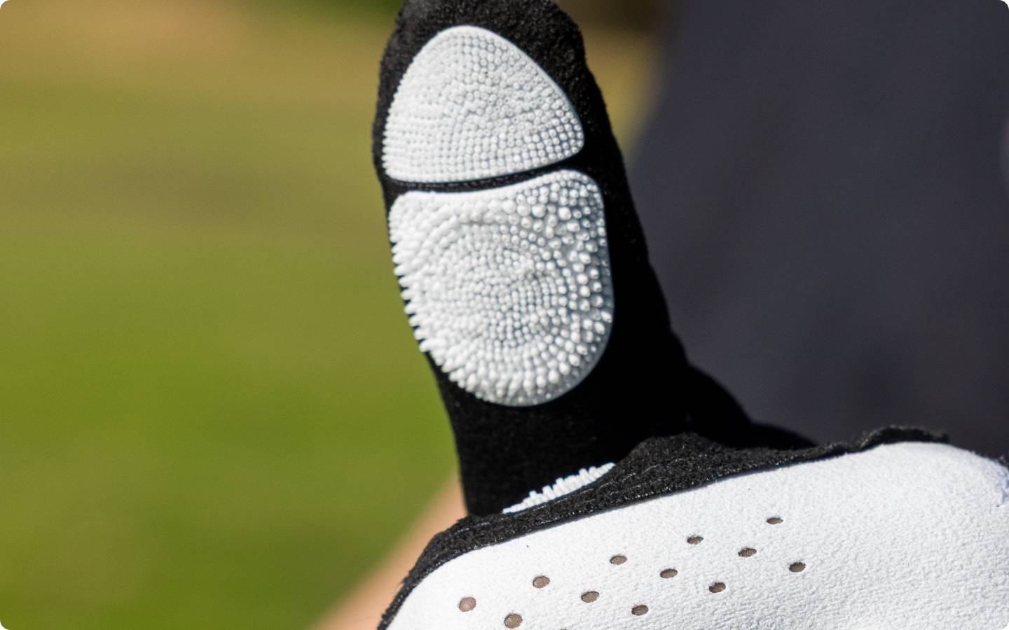 Close up of the thumb of the EXO golf glove with white nanocells